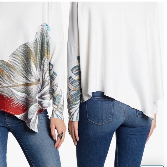 An asymmetrical hem lends a chic vibe to this soft and cozy pullover. - Picture 2 of 6